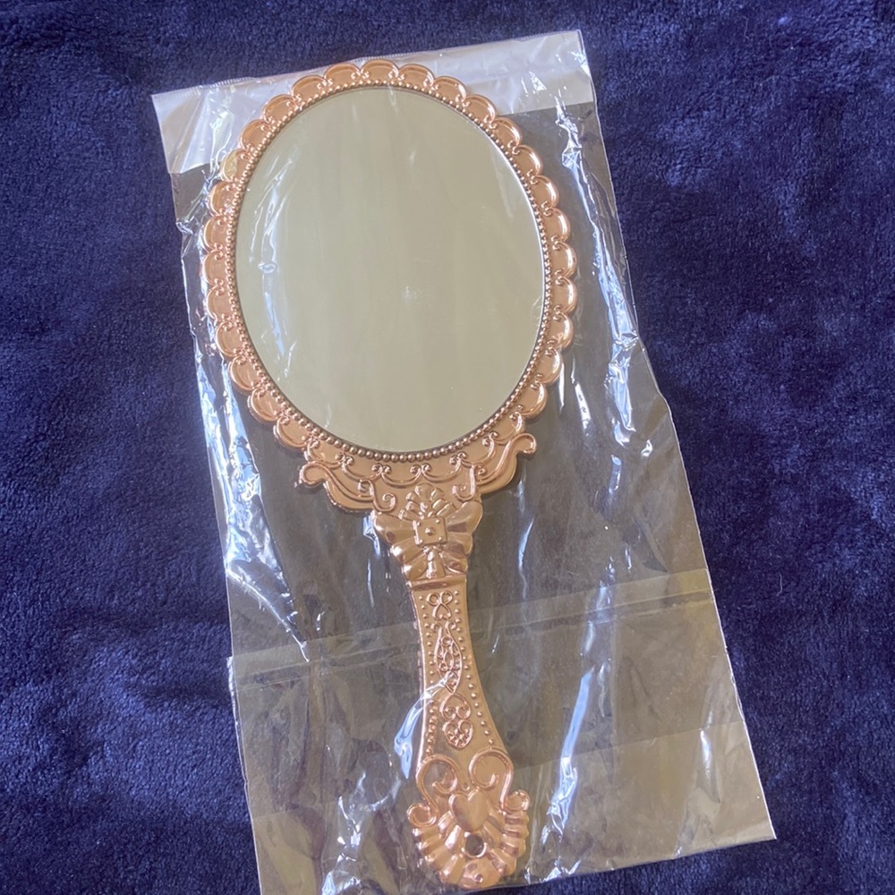 Large handheld mirror.
